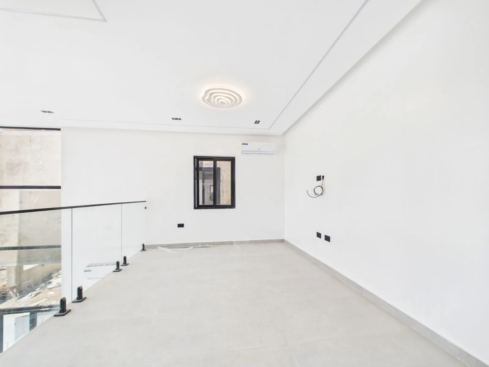 Empty upstairs lounge before virtual staging